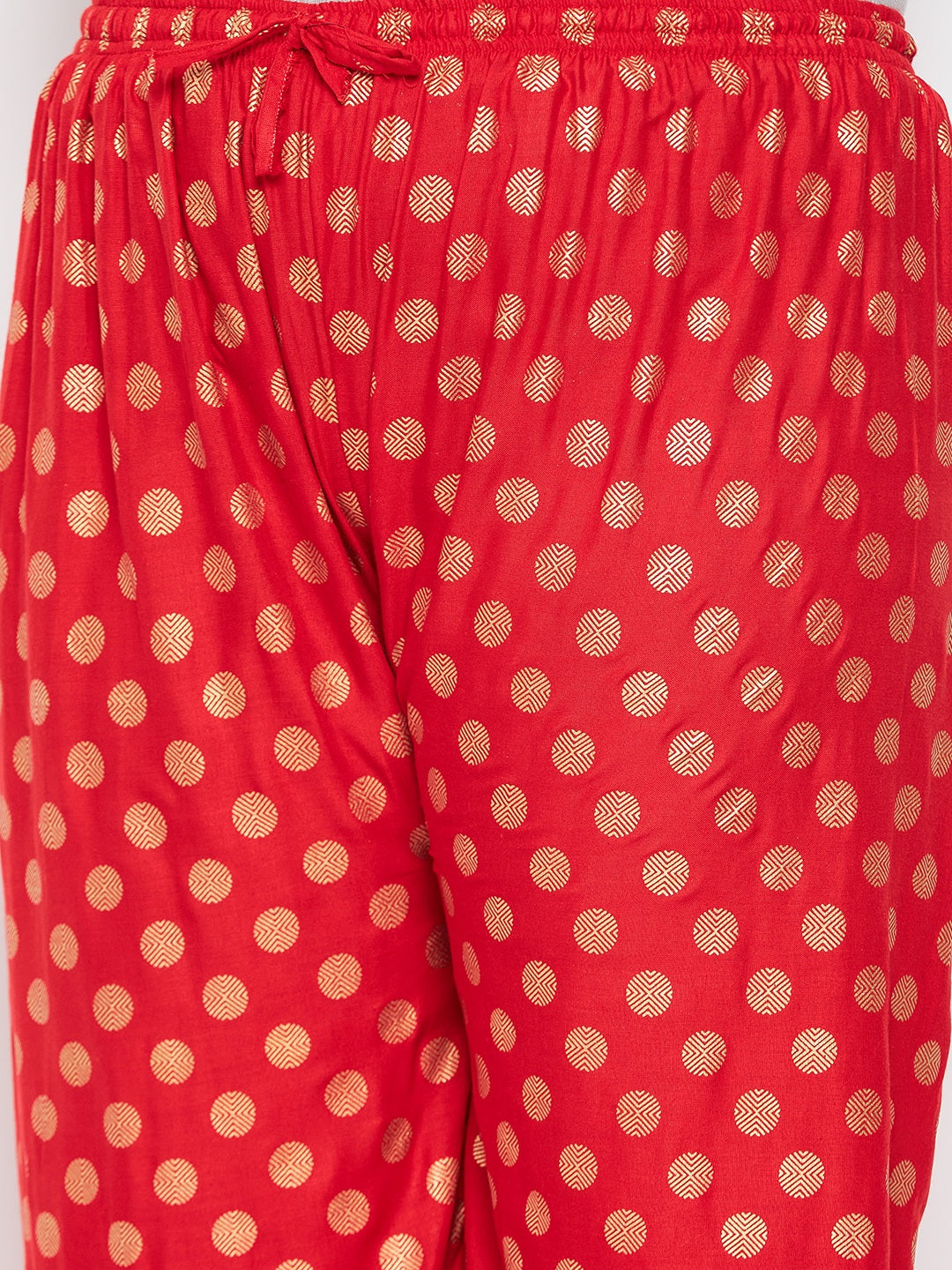 Red polka dot printed palazzo with elastic waistband and drawstring.