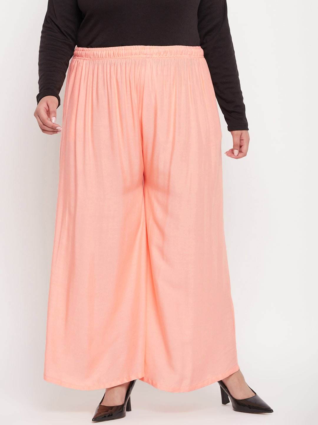 Peach Solid Rayon Jumbo Sharara with elasticated waistband and drawstring.