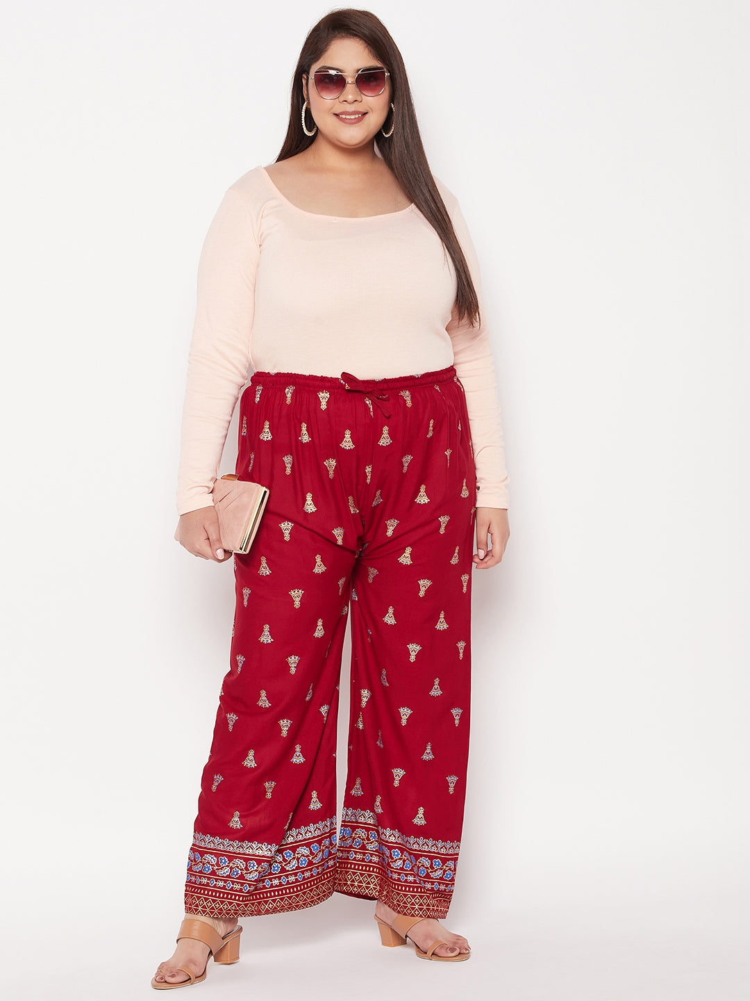 Maroon printed rayon straight palazzo with elasticated waistband and drawstring.