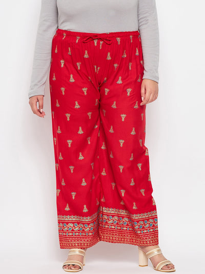 Red printed rayon straight palazzo with elastic waistband and drawstring.