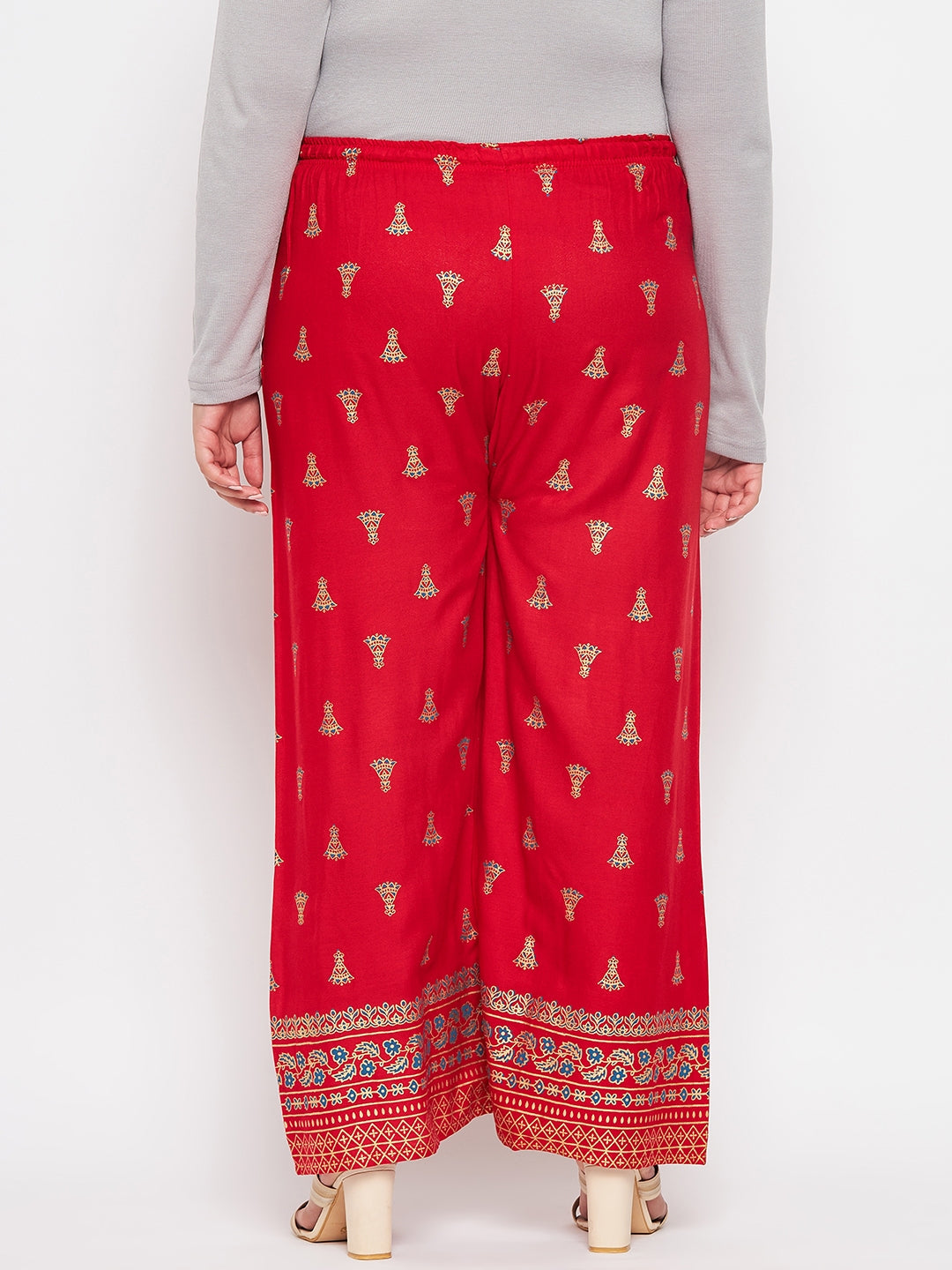 Red printed rayon straight palazzo with elasticated waistband and drawstring.