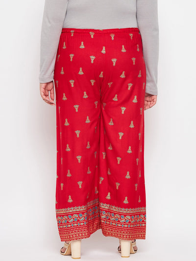 Red printed rayon straight palazzo with elasticated waistband and drawstring.