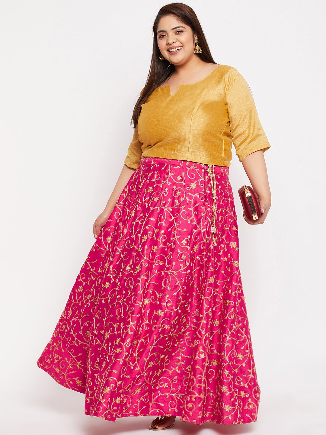 Magenta and gold embroidered flared skirt with drawstring waistband.