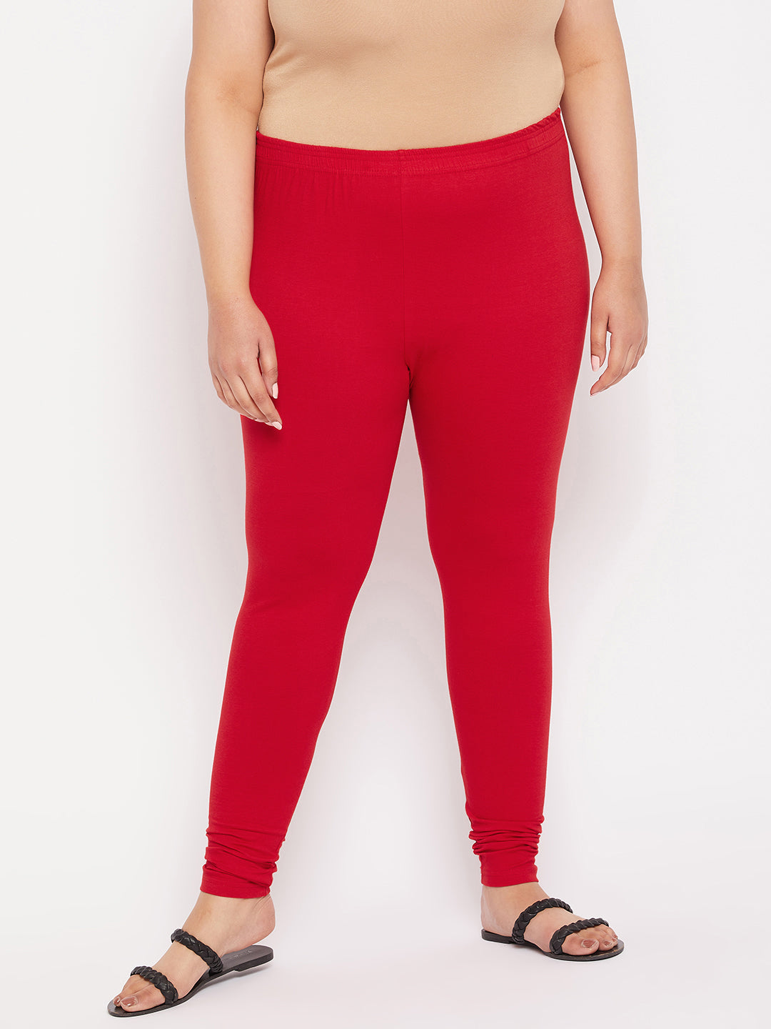 Red solid ankle length leggings with elasticated waistband.