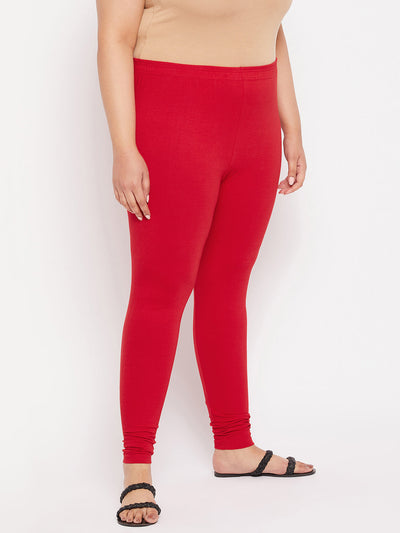 Red solid ankle length leggings with elasticated waistband.