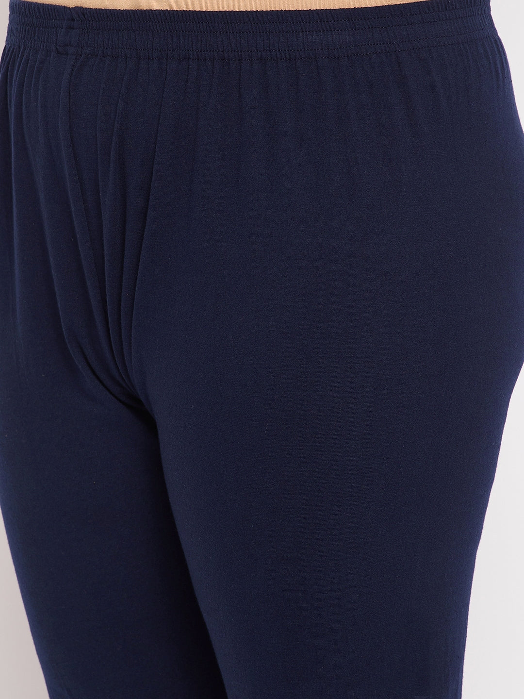 Navy blue solid ankle length leggings with elasticated waistband.