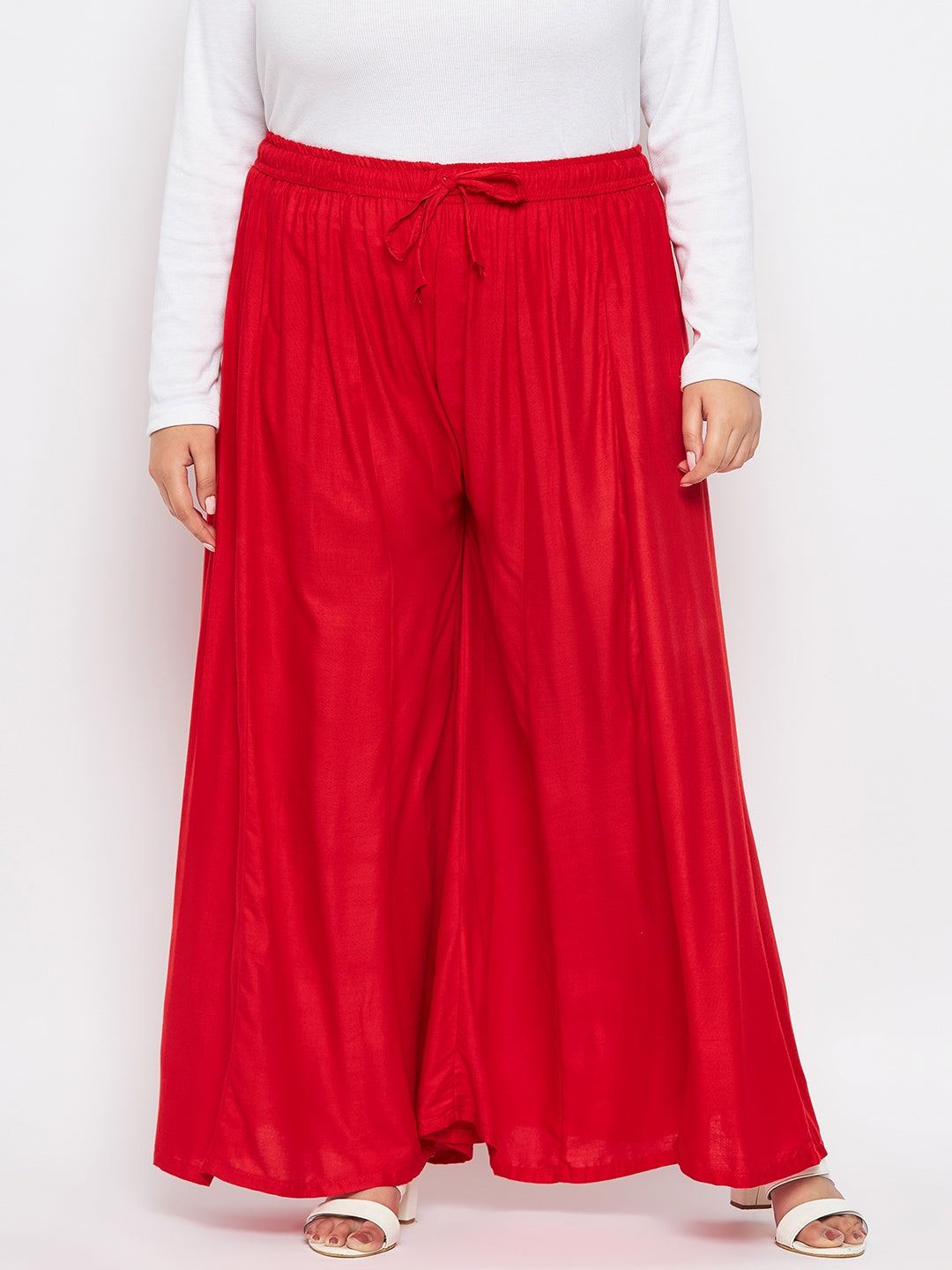 Red Solid Rayon Flared Sharara with elasticated waistband and drawstring.