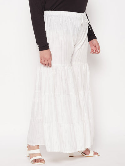 White striped rayon flared gharara with elastic waistband and drawstring.