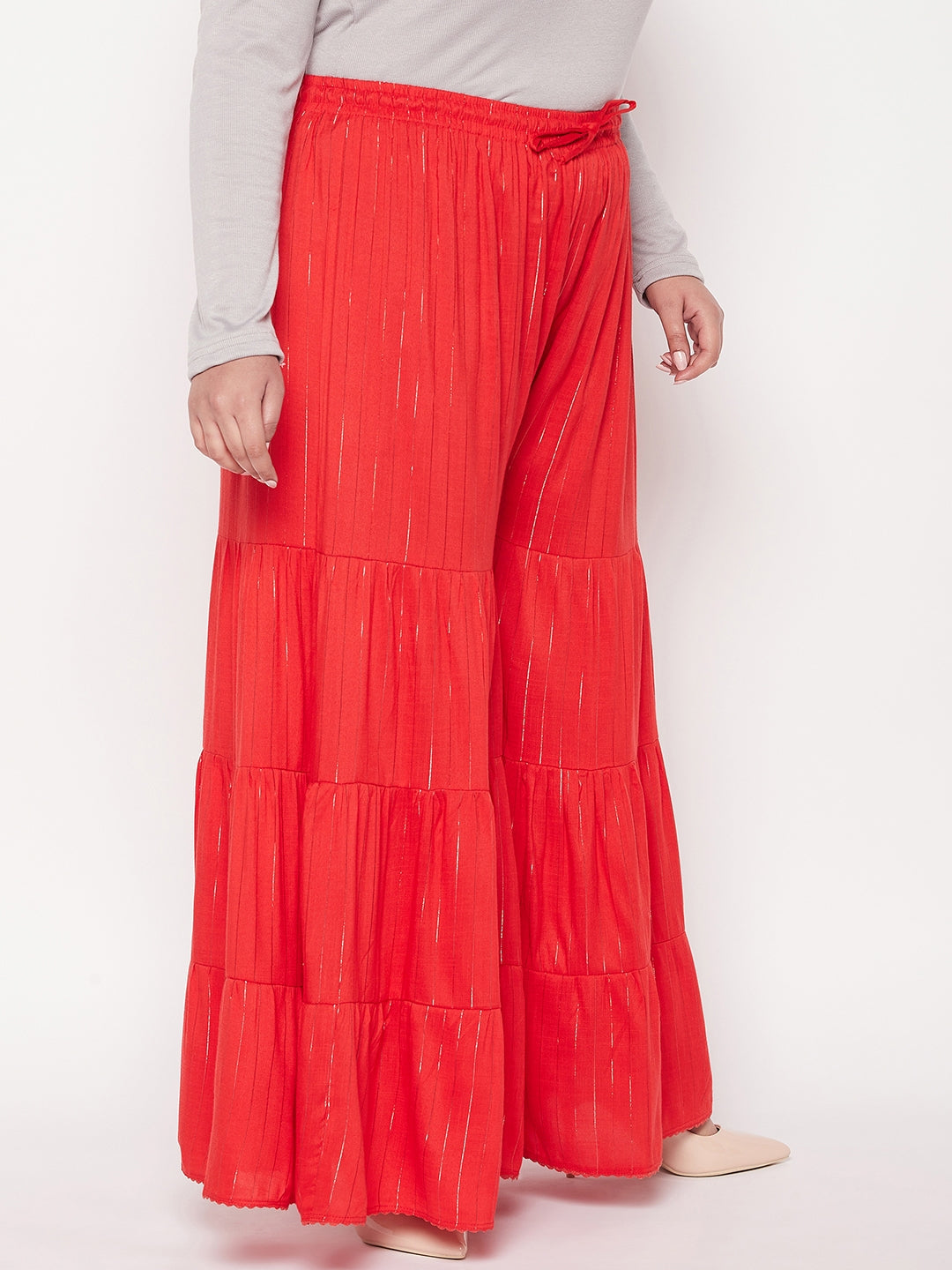 Red striped rayon flared gharara with elasticated waistband and drawstring.