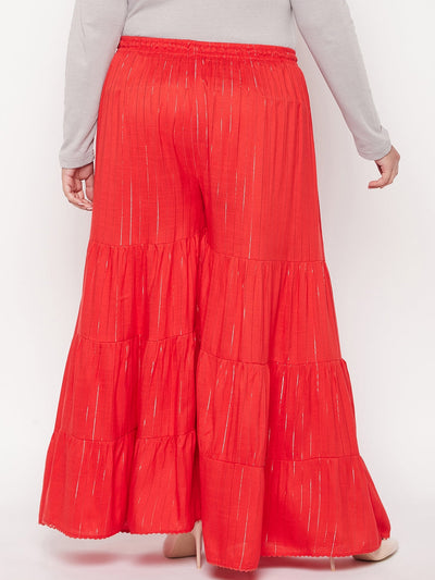 Red striped rayon flared gharara with elasticated waistband and drawstring.