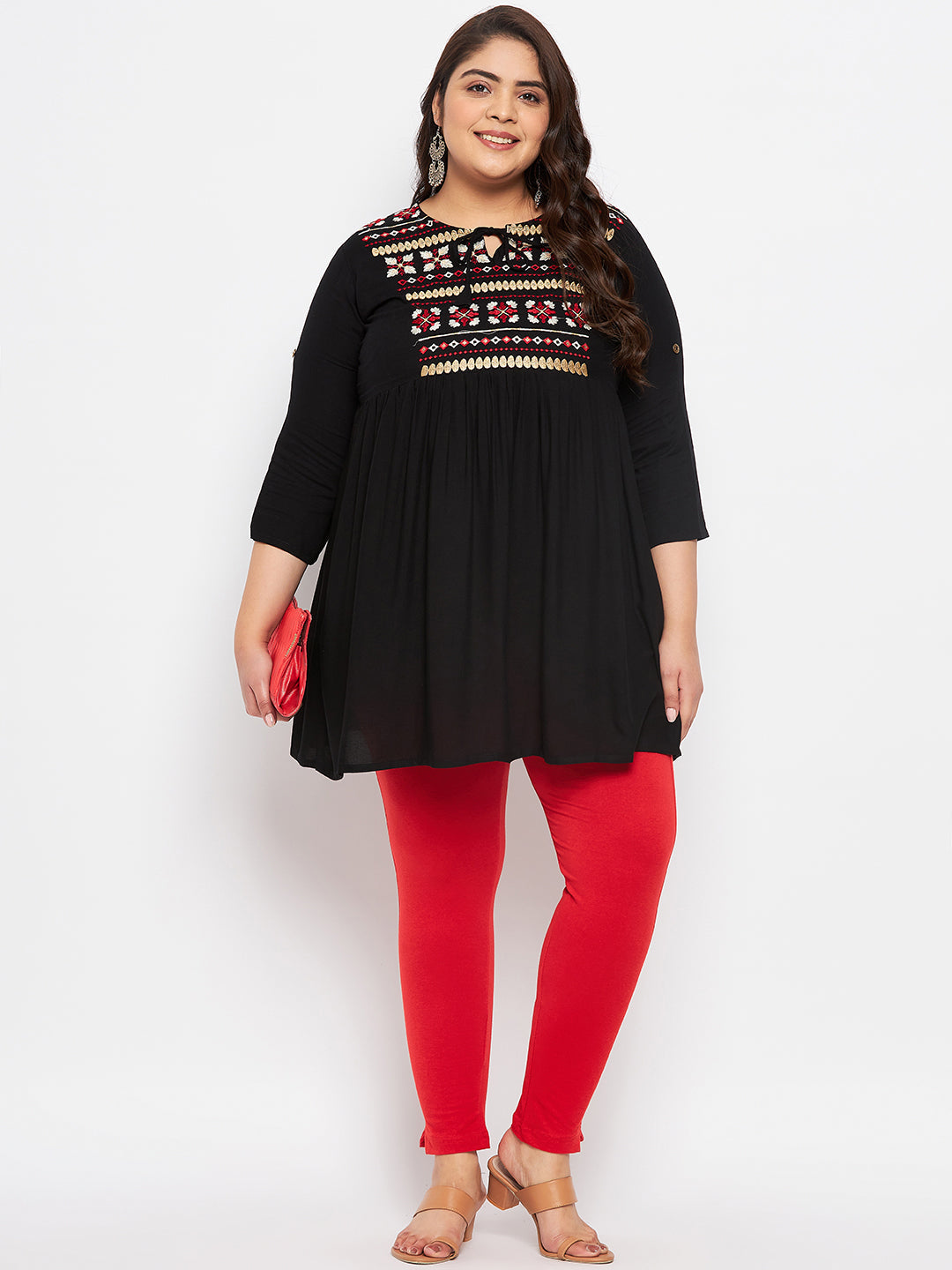 Red solid ankle length leggings with elasticated waistband.