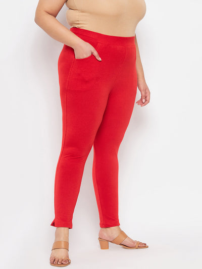 Red solid ankle length leggings with elastic waistband.