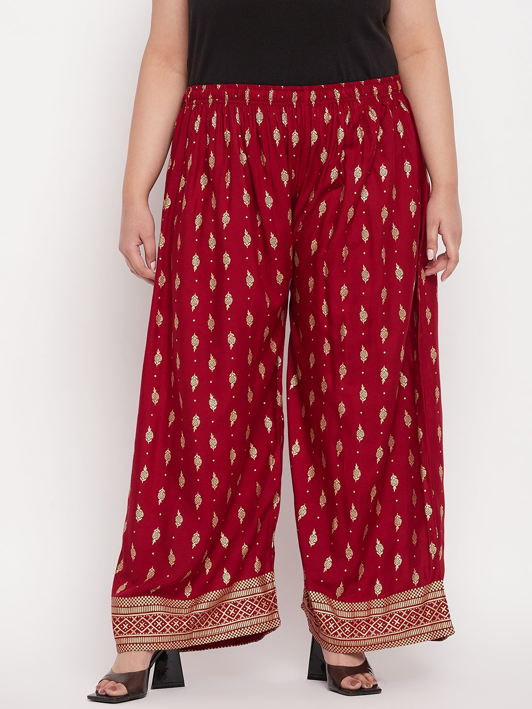 Maroon printed wide leg rayon palazzo with elasticated waistband and drawstring.