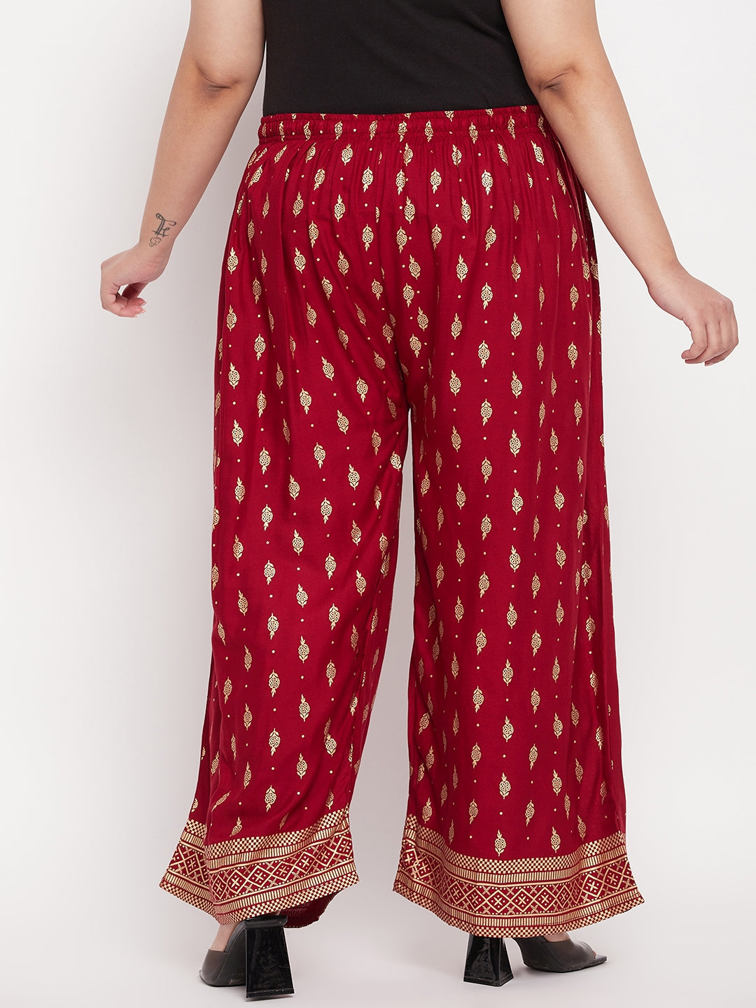 Maroon printed wide leg rayon palazzo with elasticated waistband and drawstring.