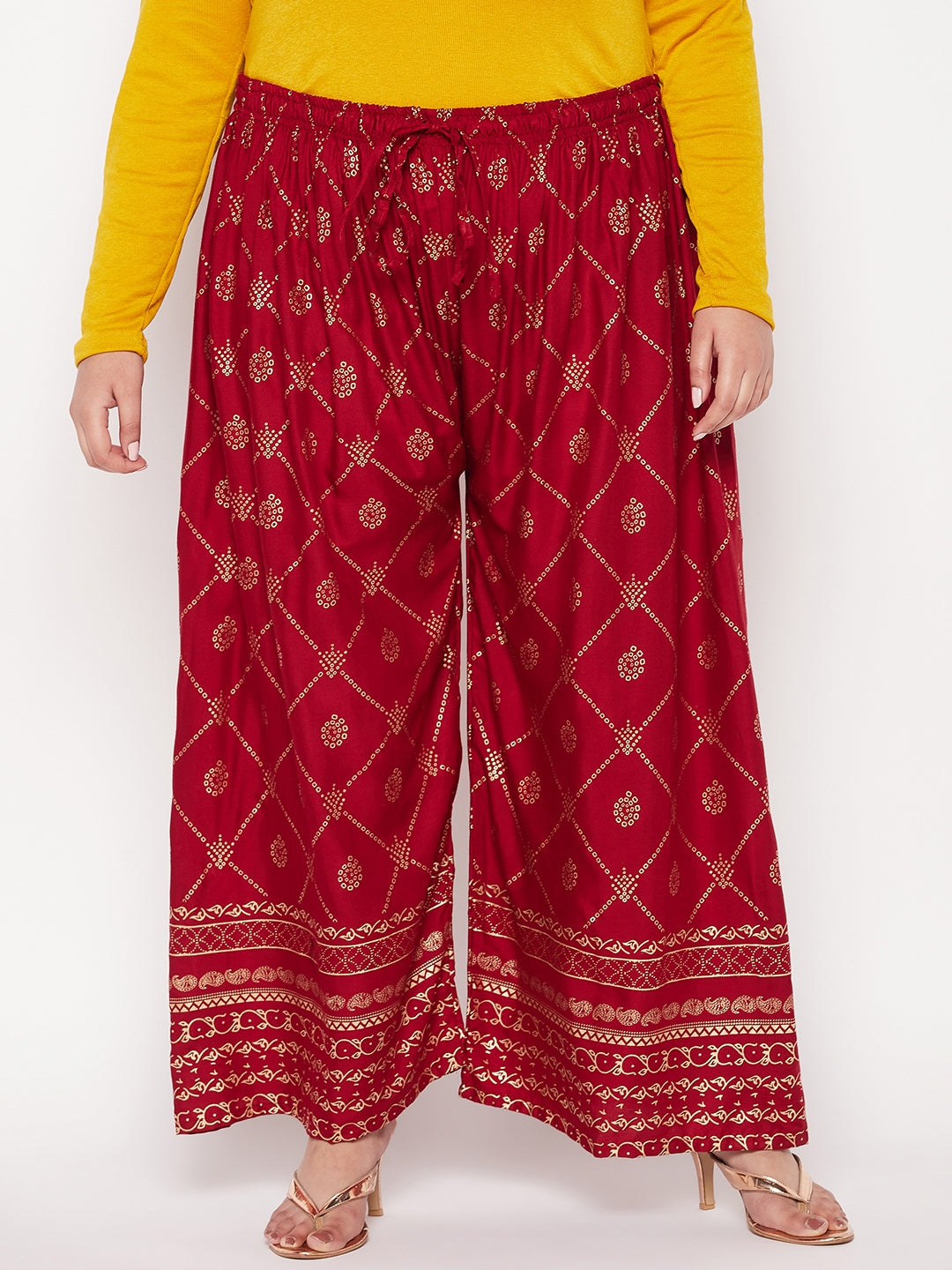 Maroon printed rayon palazzo with elasticated waistband and drawstring.