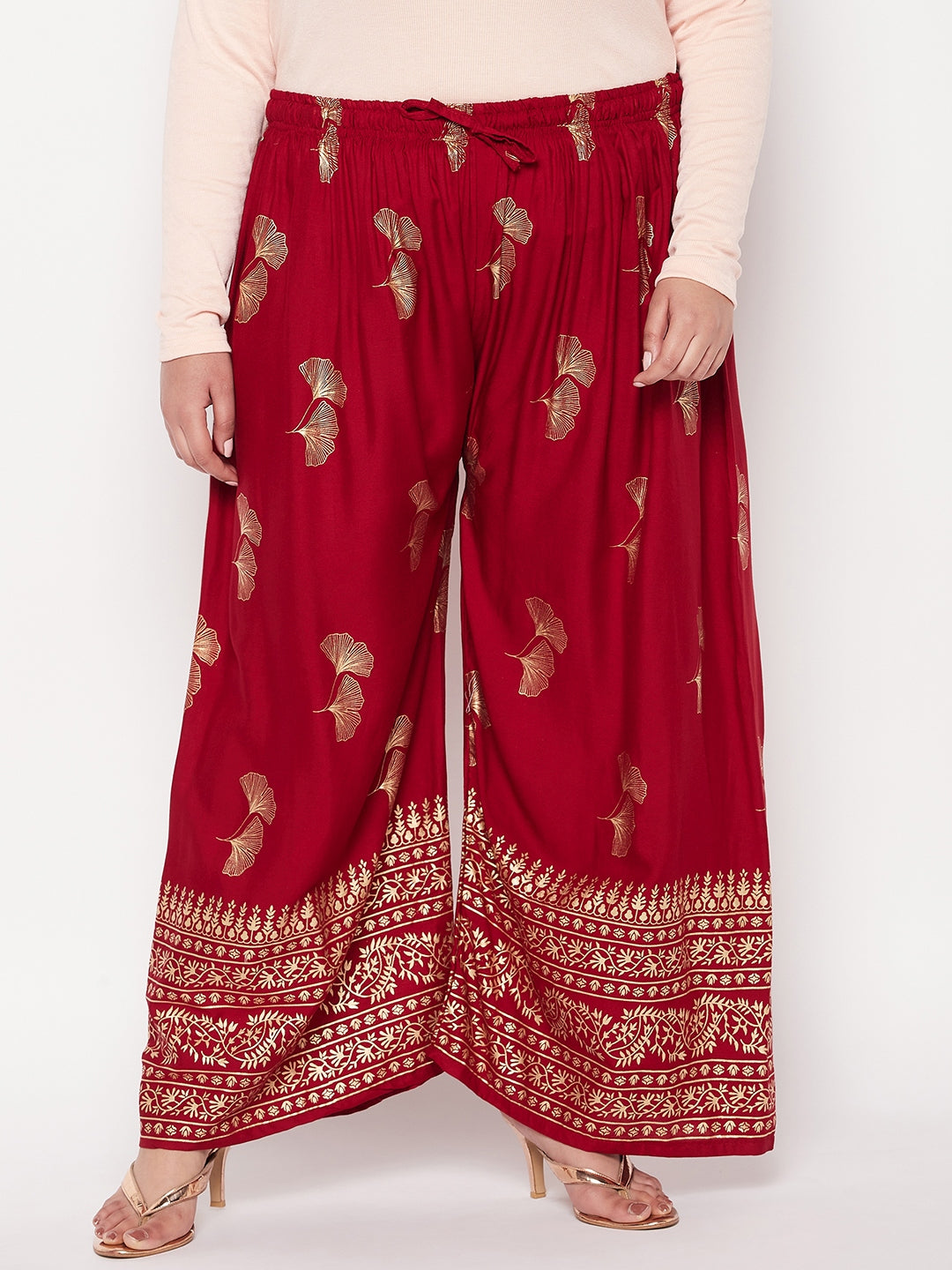 Maroon printed wide leg rayon palazzo with elasticated waistband and drawstring.