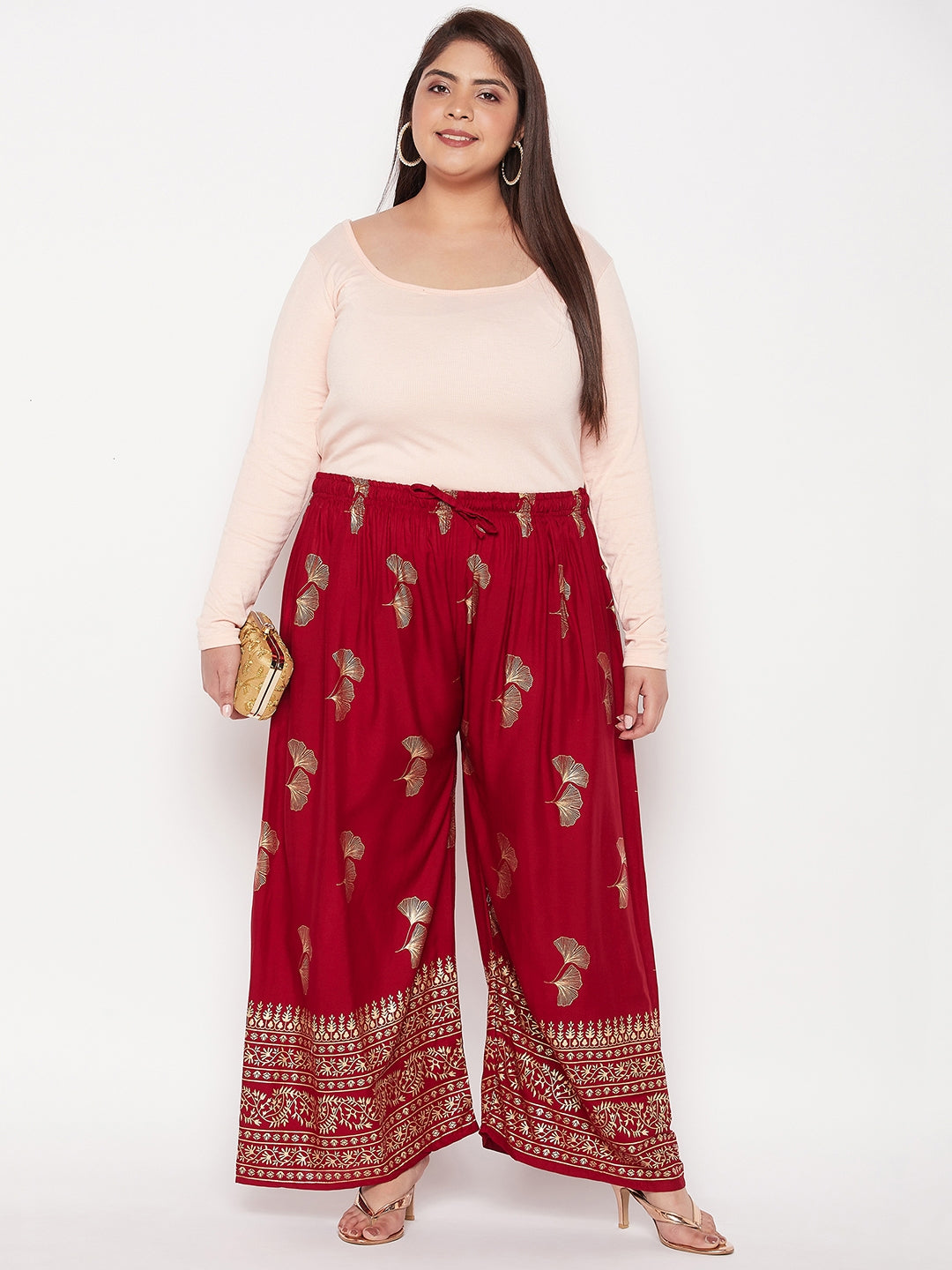 Maroon printed wide leg rayon palazzo with elasticated waistband and drawstring.