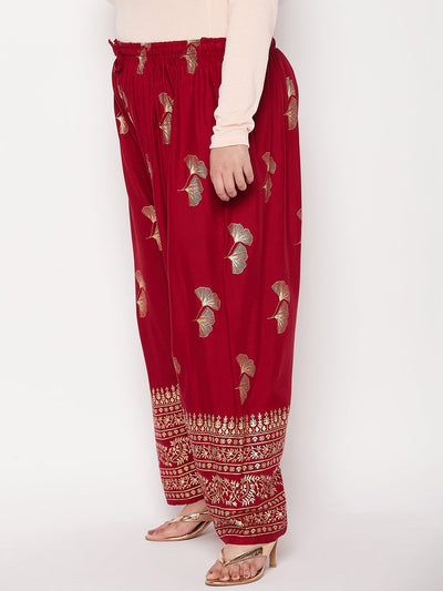 Maroon printed wide leg rayon palazzo with elasticated waistband and drawstring.