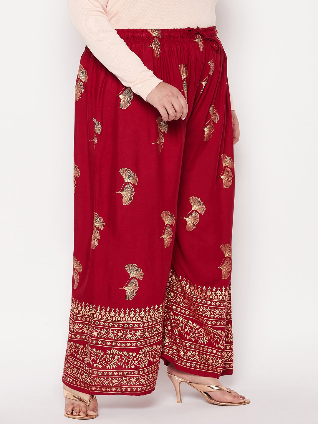 Maroon printed wide leg rayon palazzo with elasticated waistband and drawstring.