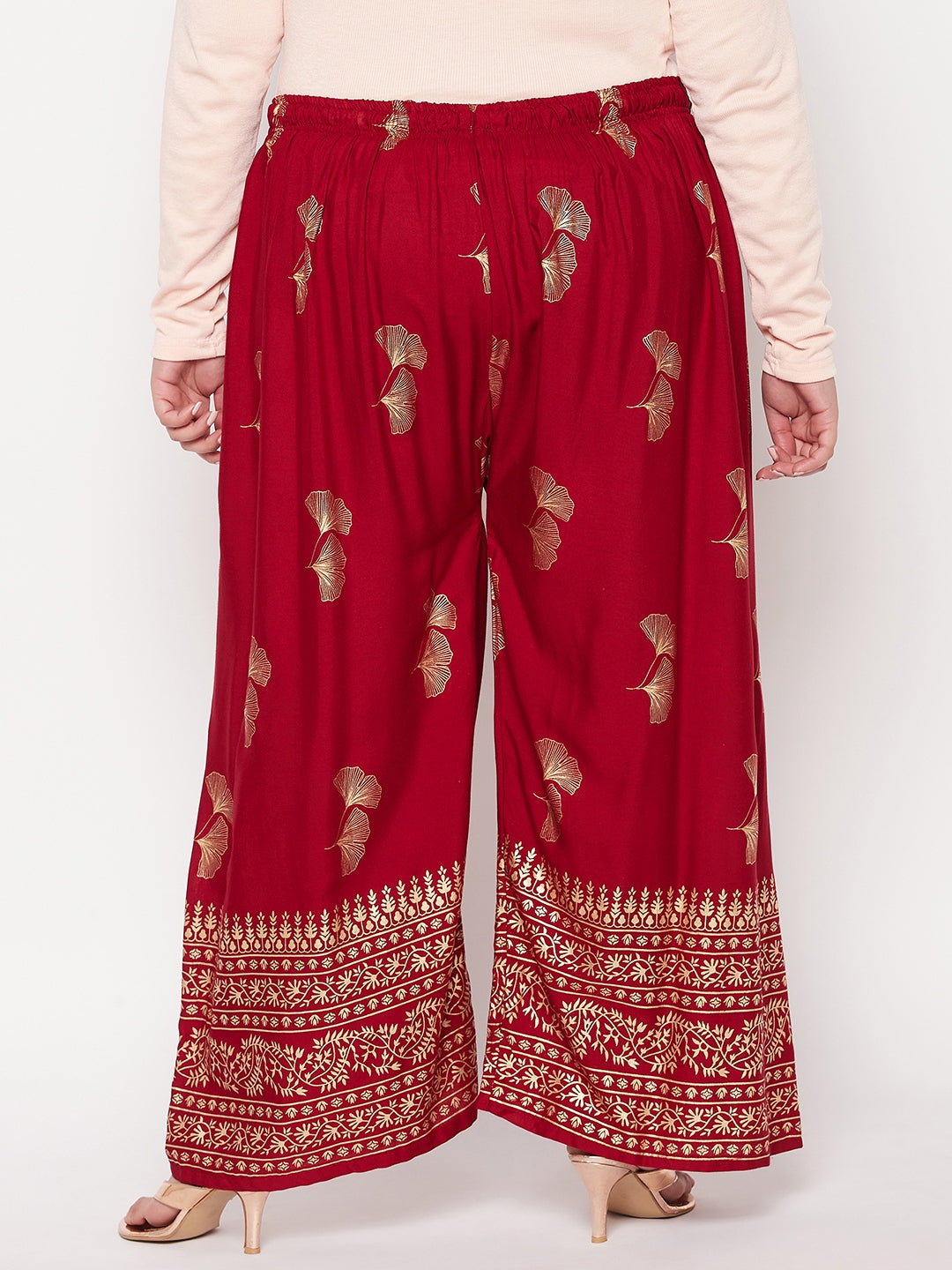 Maroon printed wide leg rayon palazzo with elasticated waistband and drawstring.