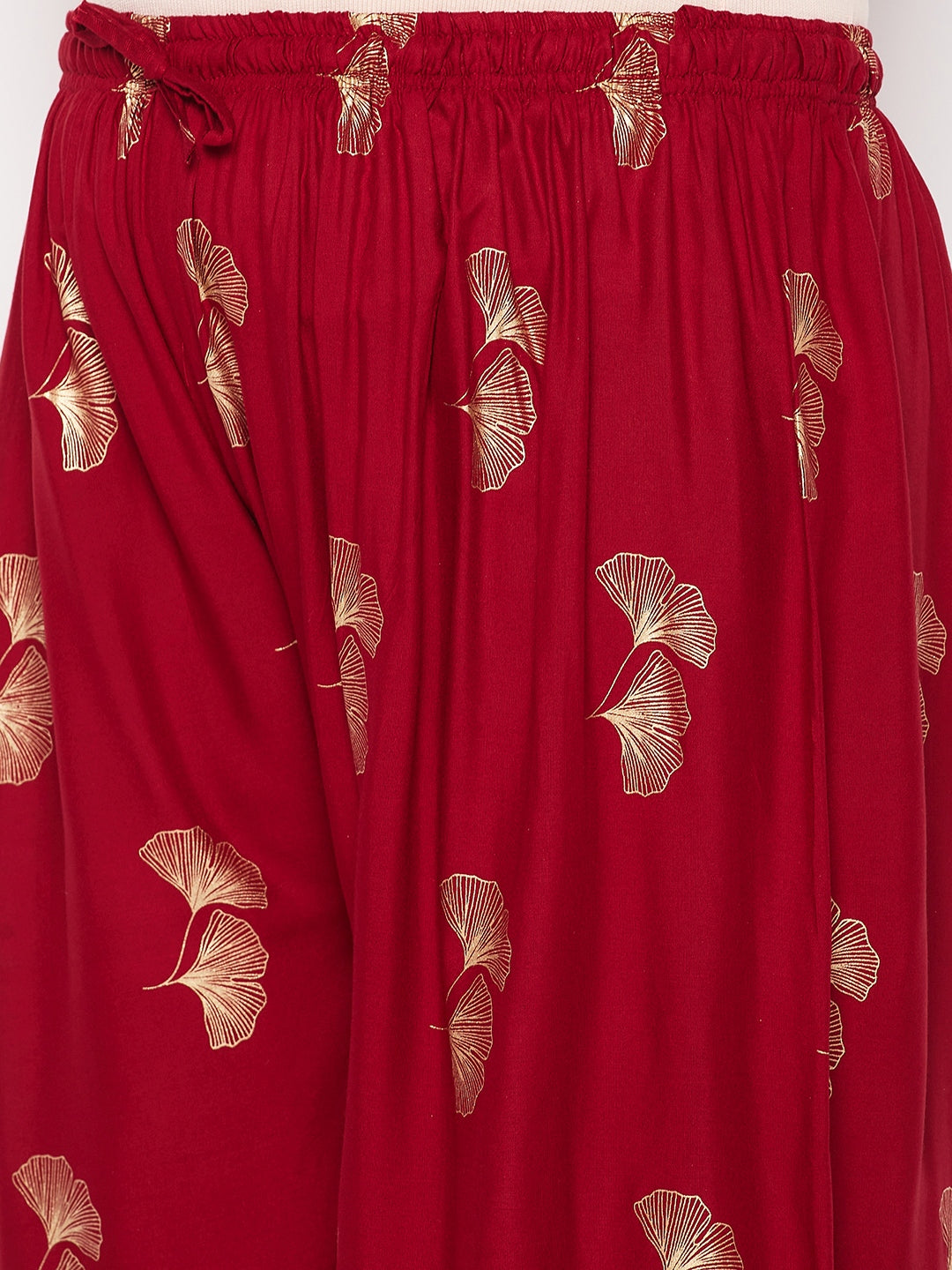 Maroon printed wide leg rayon palazzo with elasticated waistband and drawstring.