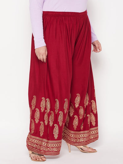 Maroon printed rayon palazzo with paisley design and elastic waistband.