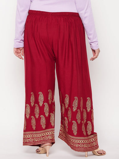 Maroon printed rayon palazzo with elasticated waistband and drawstring.