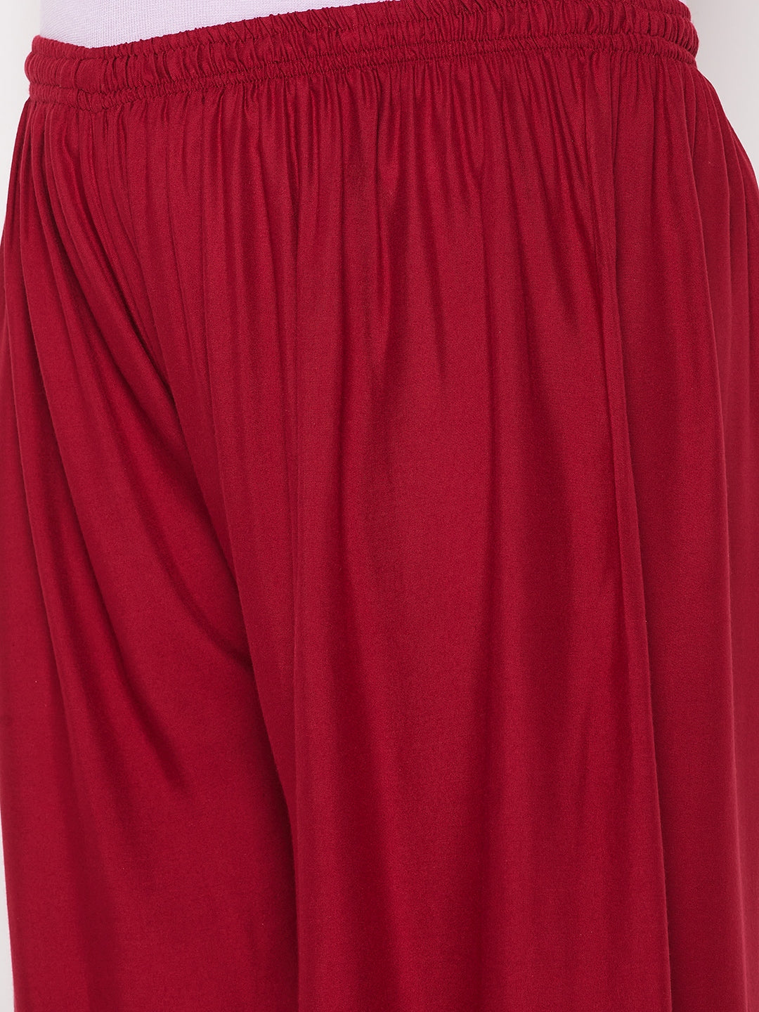 Maroon printed rayon palazzo with elastic waistband and drawstring.