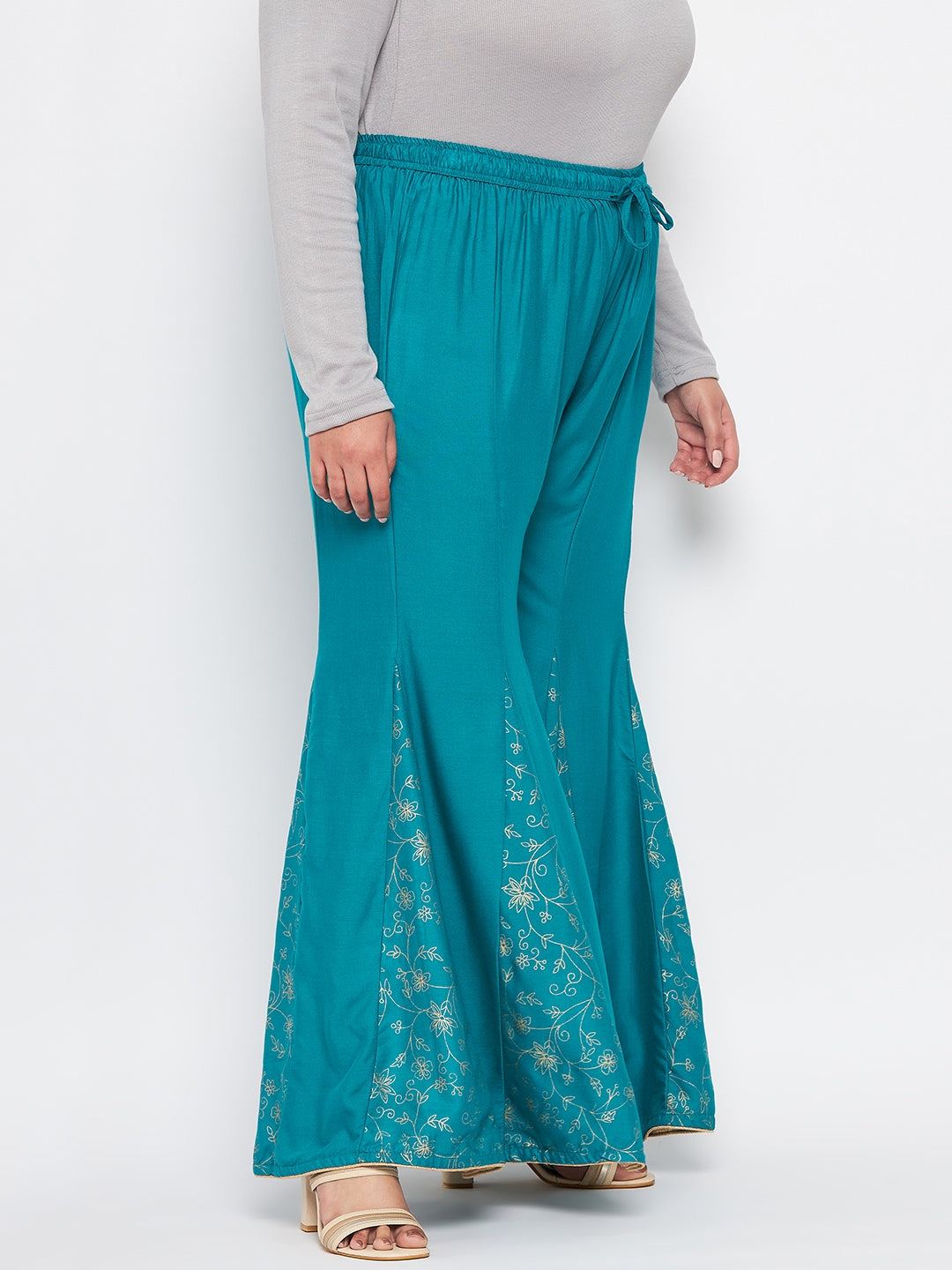 Rama Green Printed Rayon Flared Sharara with elasticated waistband and printed hem design.