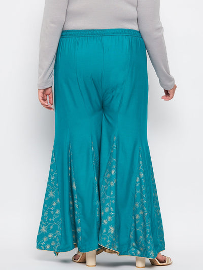 Rama Green Printed Rayon Flared Sharara with elasticated waistband and floral hem design.