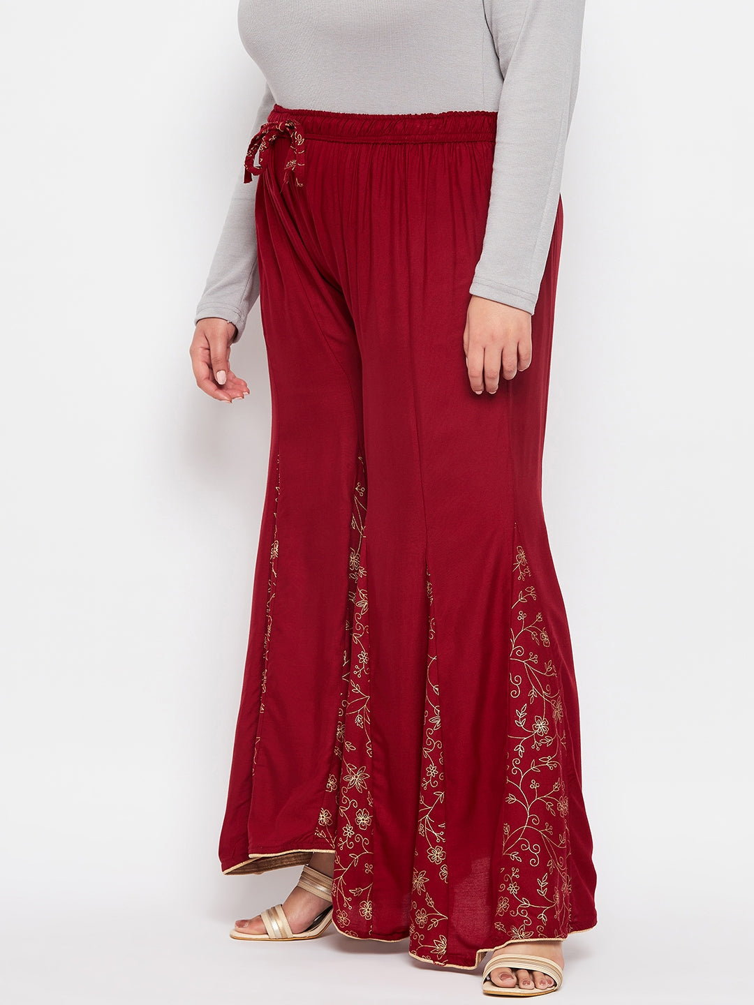 Maroon printed rayon flared sharara with elasticated waistband and drawstring.