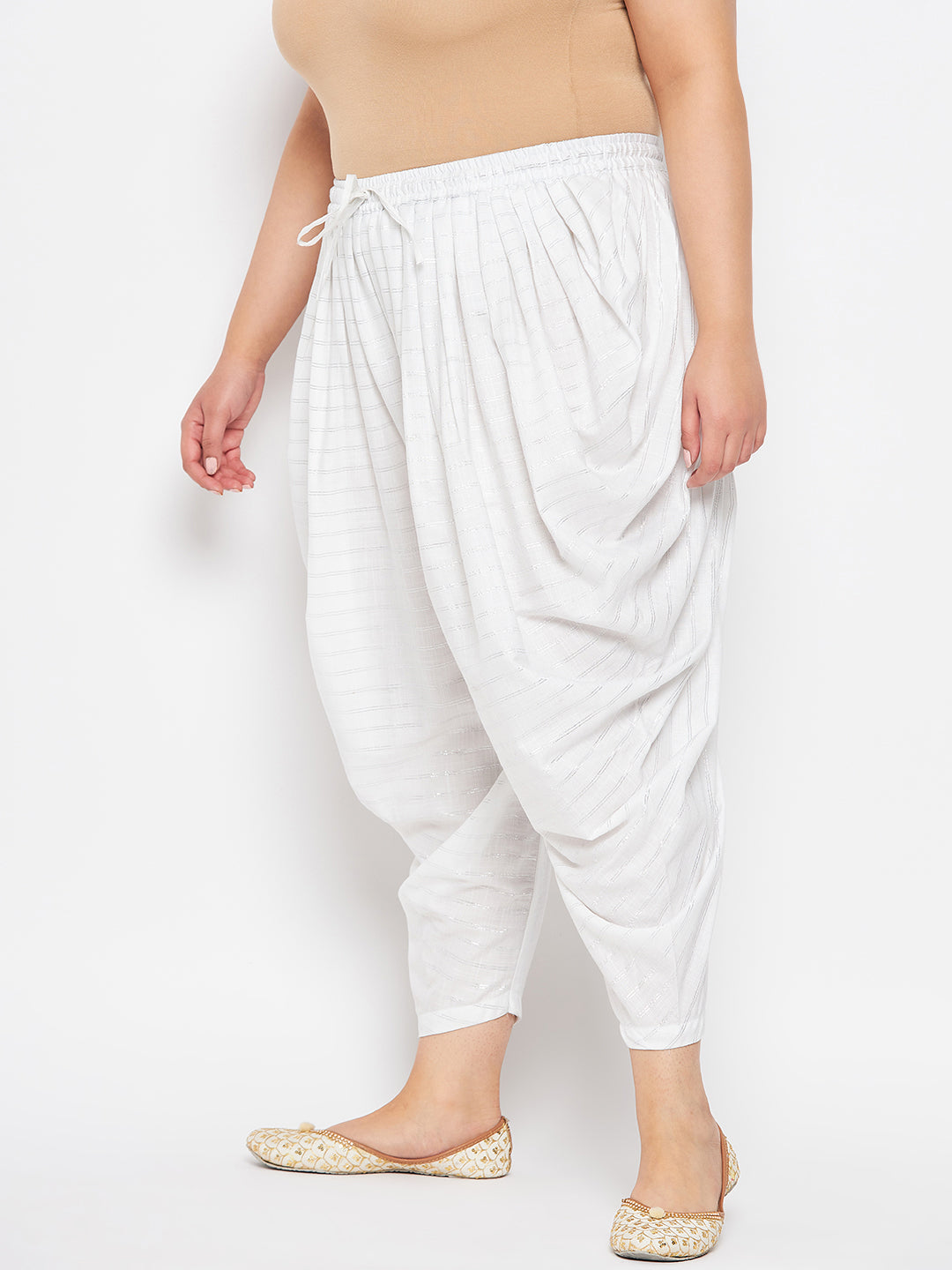 White striped rayon dhoti salwar with elastic waistband and drawstring.