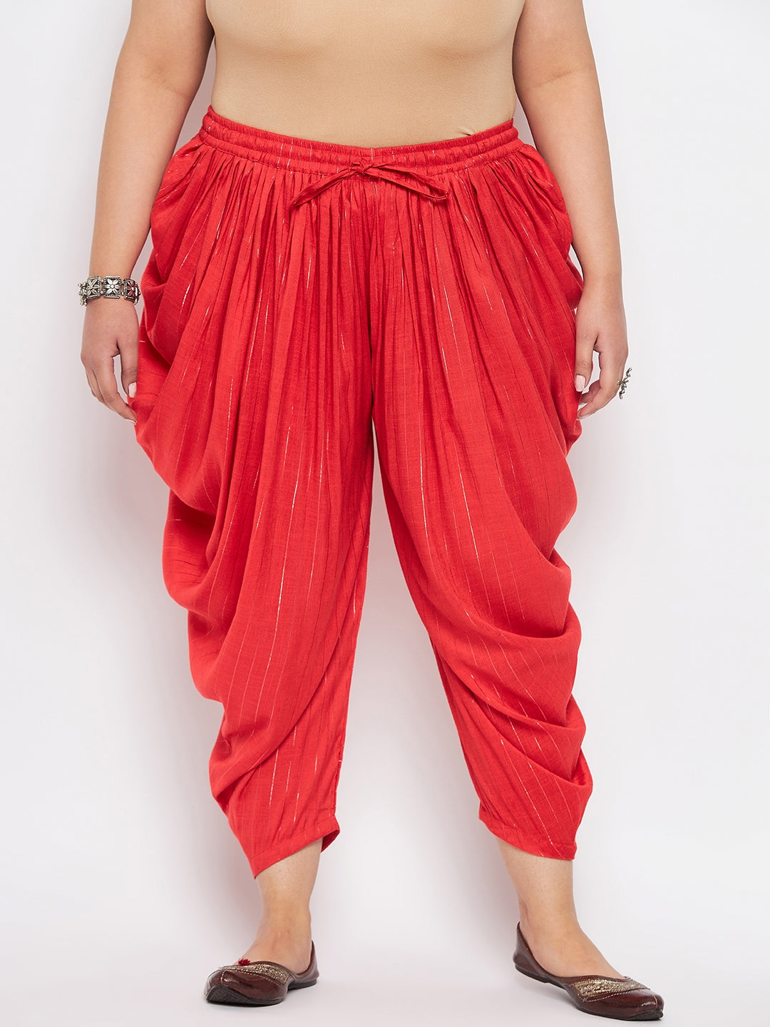 Ankle-length red striped rayon dhoti salwar with elastic waistband and drawstring.