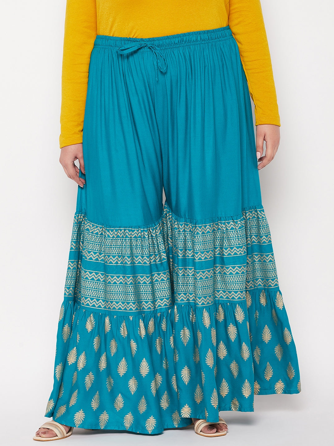 Rama Green printed rayon flared gharara with elasticated waistband and drawstring.