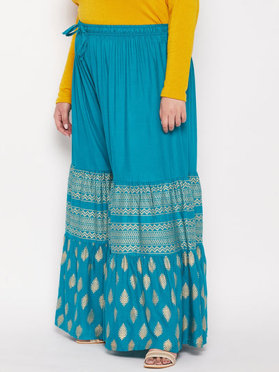 Rama green printed rayon flared gharara with elasticated waistband and drawstring.