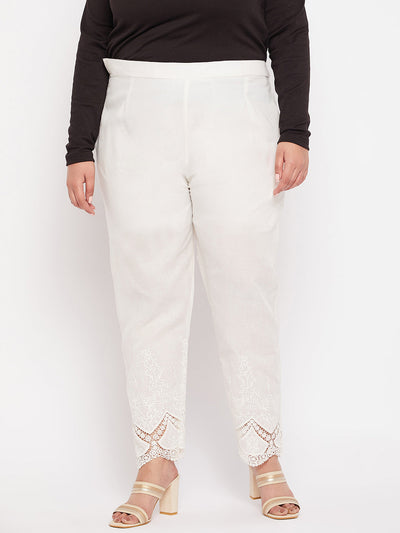 Off-white solid cotton embroidered ankle-length pant with partially elasticated waistband.