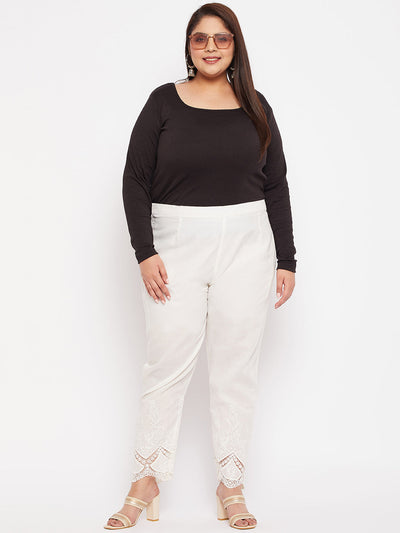 Off-white ankle-length embroidered cotton pants with a partially elasticated waistband.