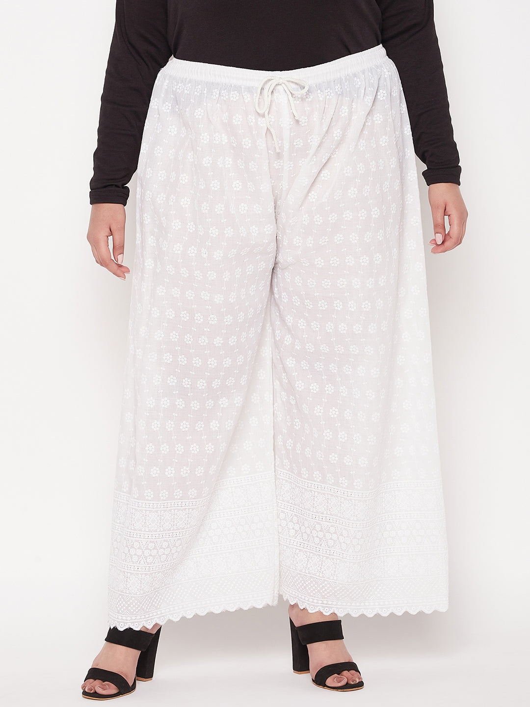 White full chikan cotton palazzo with embroidered wide-leg design and elasticated waistband.