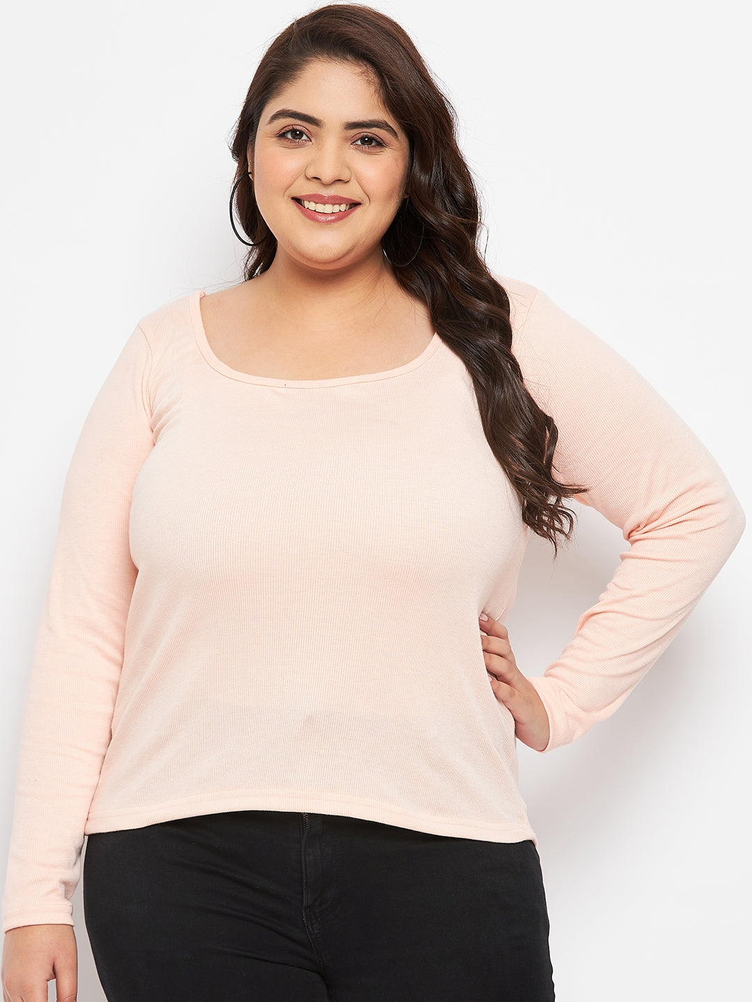 Peach solid full sleeves top made of polyester, cotton, and elastane.