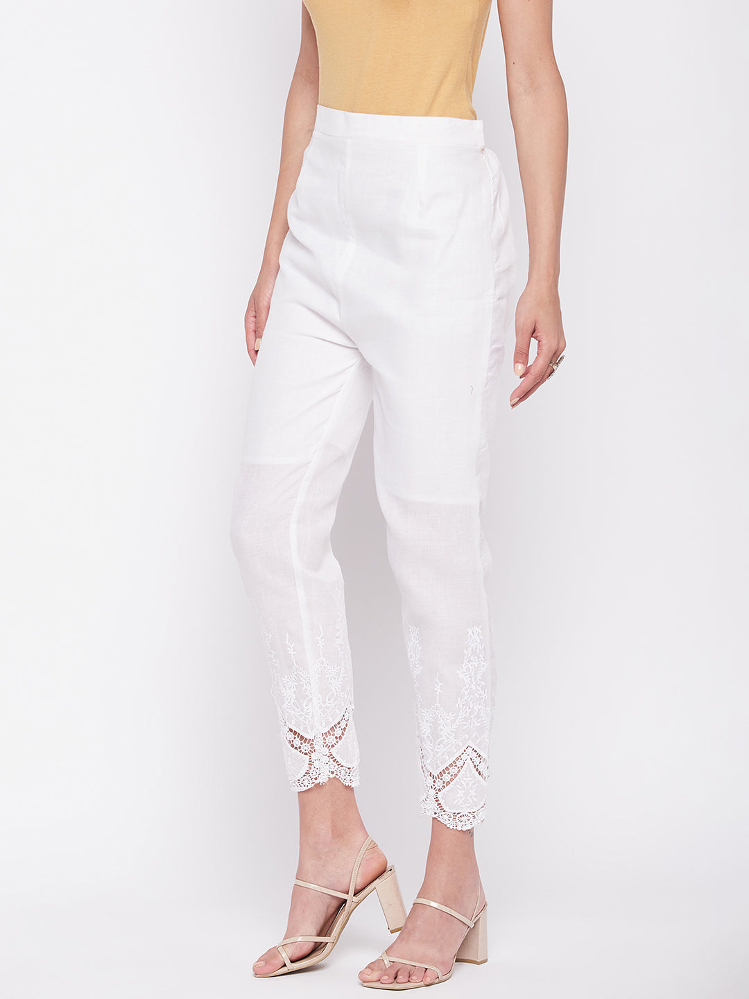 White solid cotton embroidered pant, ankle length with partially elasticated waistband.