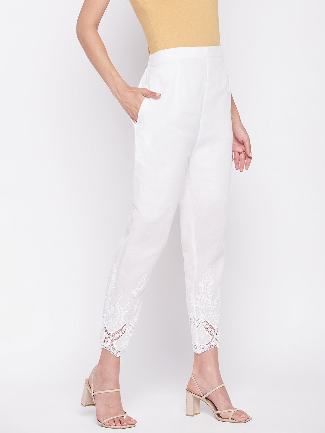 White solid cotton embroidered pant, ankle length with partially elasticated waistband.